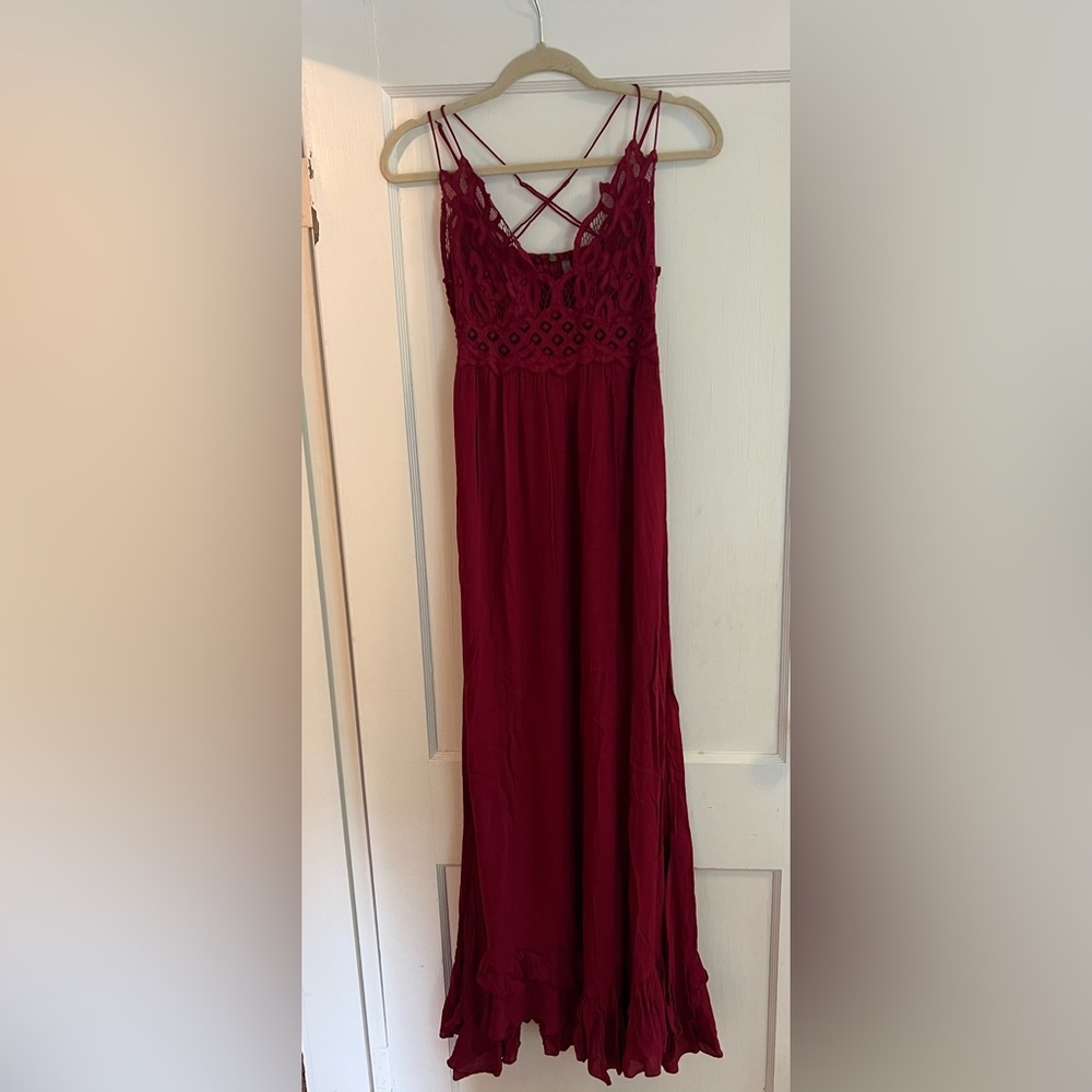 Free People burgundy maxi dress with a crochet bodice and flowy skirt